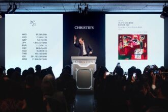 Auctioneer Adrien Meyer selling Jean-Michel Basquiat’s Sabado por la Noche (Saturday Night) (HK$112,625,000 / US$14,544,212) during Christie’s 20th / 21st Century Evening Sale in Hong Kong